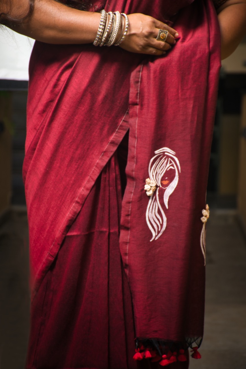 Soft Linen Silk Full Maroon Saree Pallu Designed by Hand Printed Abstract Beautiful Women Face And Decorate With 3D Satin Flower attached - She Trendz Exclusive